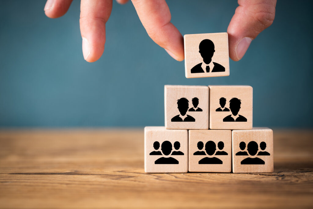 organization and team structure symbolized with cubes on wooden background